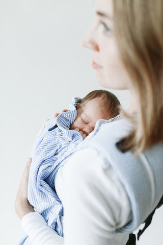 Woman carrying premature baby in Weego PREEMIE